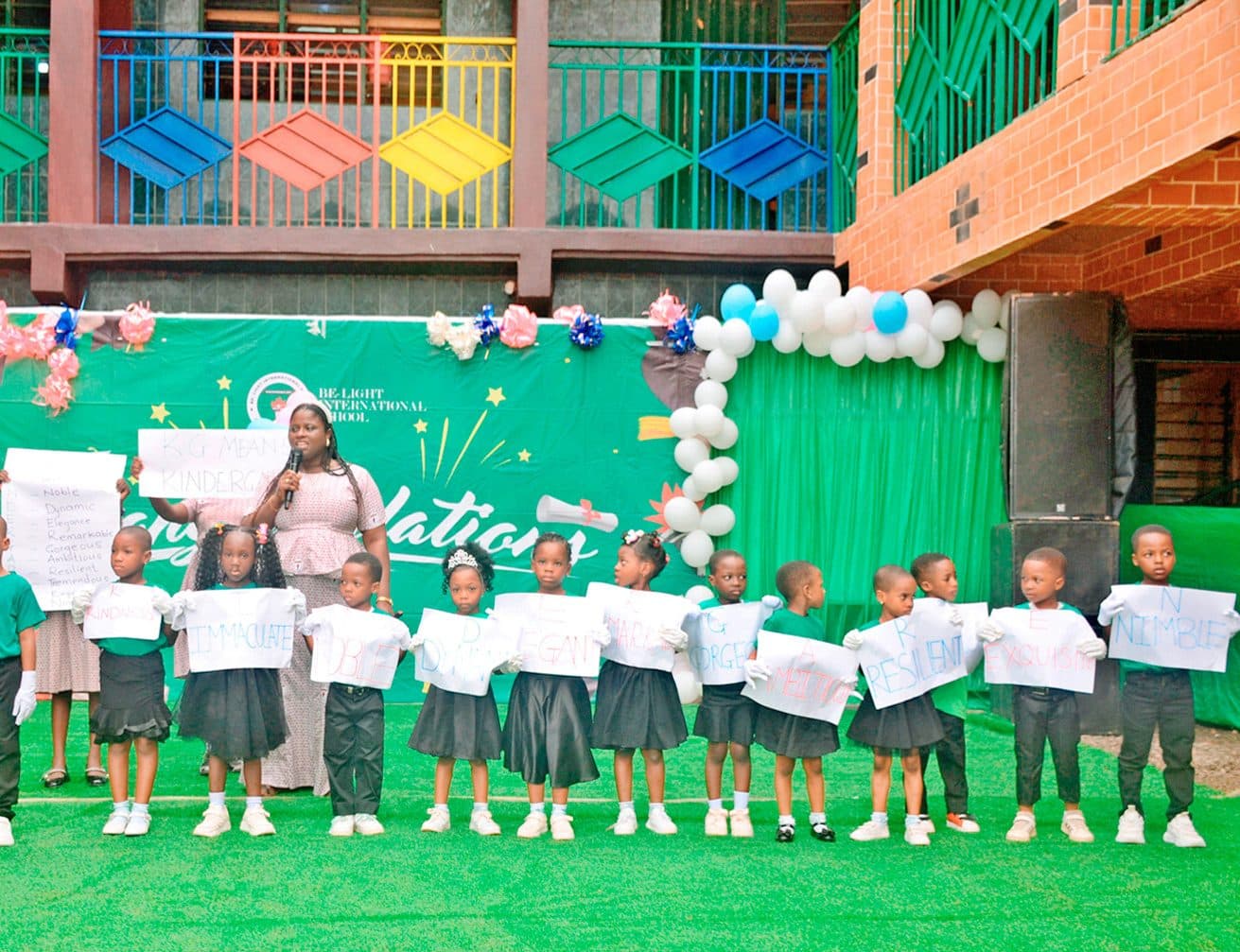 Young pupils holding certificates at Be-Light International School